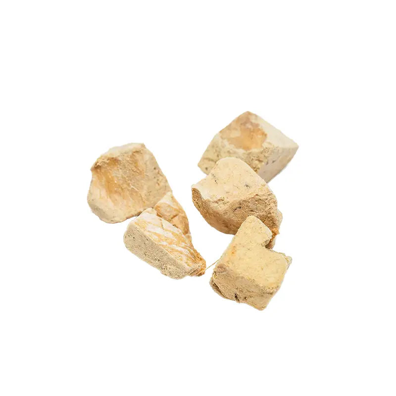 Five beige stones on a white background