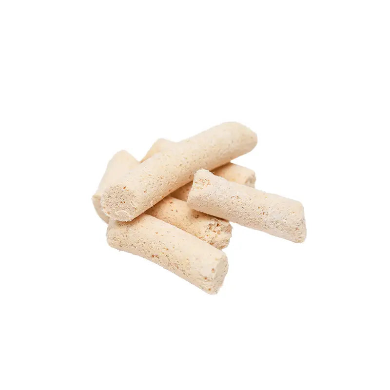 Stack of beige cylindrical objects on a white background