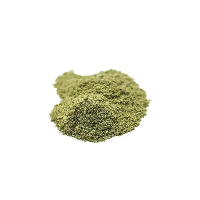 Green powder on a white background