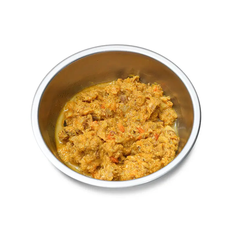 Stainless steel bowl with pet food on a white background